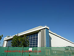 South corner view of the glass panel side and adjoining curtain wall