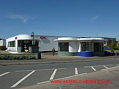 Art deco, white-painted gatehouse and personnel building