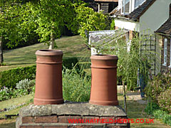 Elevated view of a chimney stack with two pots flaunched in place