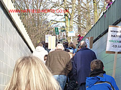 Marchers emerging from the underpass in front of WHBC offices on The Campus