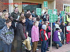 Marchers posing for a photographer from the local press on the steps to the council offices