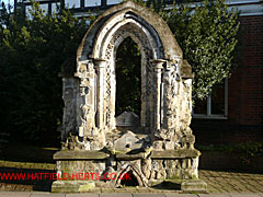 arched stone window frame from the Church of St Mary the Less